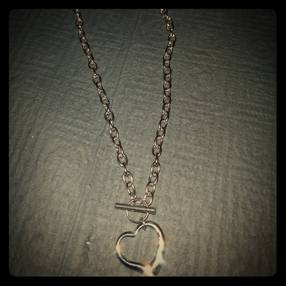Short chain necklace with heart pendant.